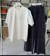 Plain white t-shirt and black flapper trouser (track suit)